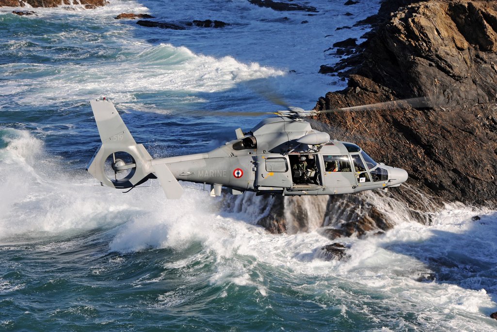 Side view of an AS565 MBe flying above the sea