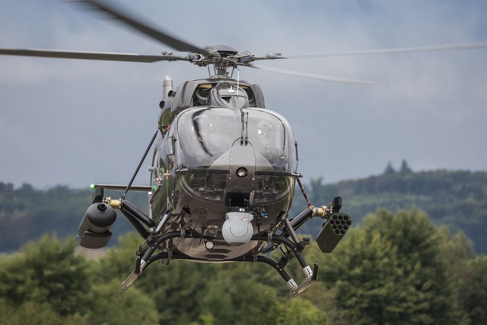 Head-on view of an in-flight Airbus H145M military helicopter in the armed scout configuration.  