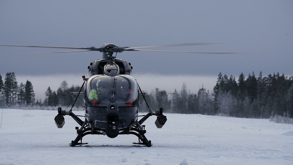 An on-ground, head-on photo of an Airbus H145M military helicopter with HForce weapon system. 
