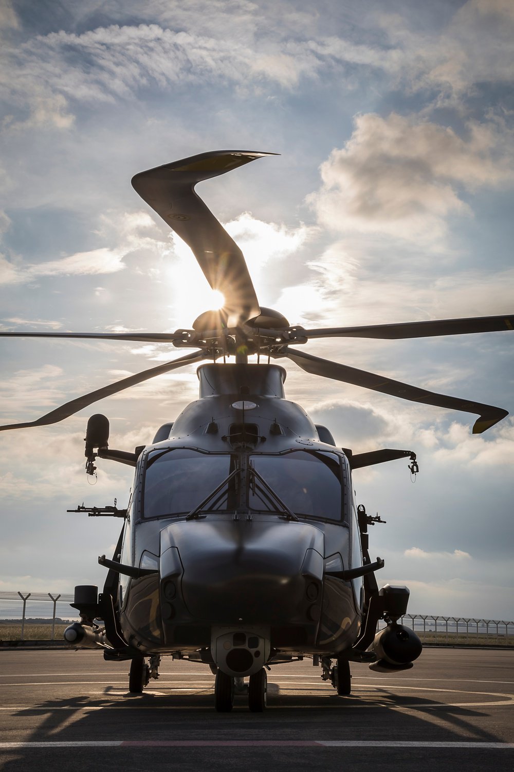 Head-on photo of an on-ground Airbus H160M military helicopter.  