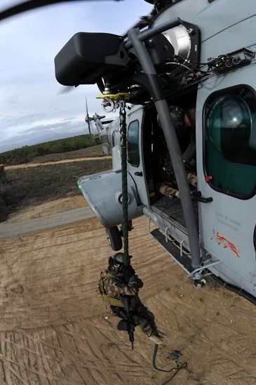 Soldier winching down from an H225M Caracal
