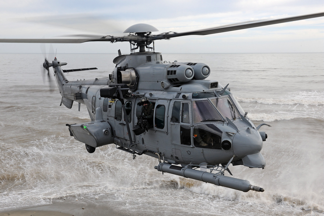 An up-close view of an in-flight EC725 military helicopter (later re-designated the H225M).