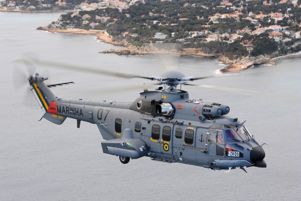 Side view of an in-flight EC725 helicopter, produced by Airbus. 