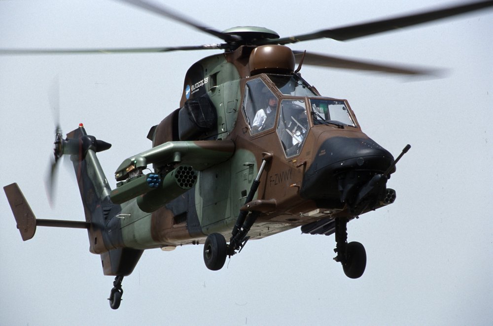 The front and side view of an in-flight, Airbus-built ARH Tiger military helicopter delivered to the Australian Army.  