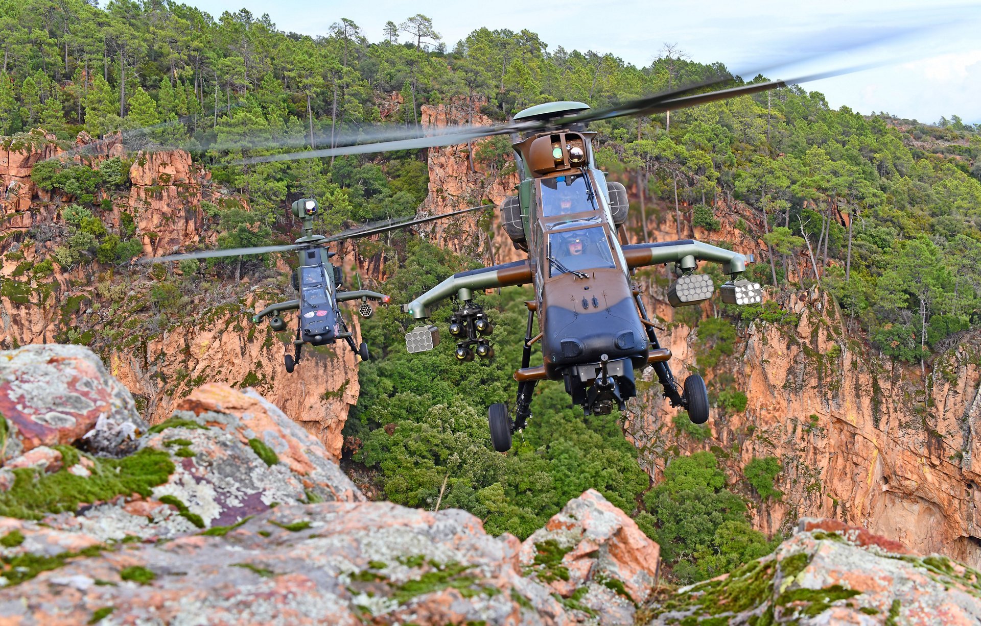 Two Tiger helicopters operated by the German Bundeswehr are shown in flight.  
