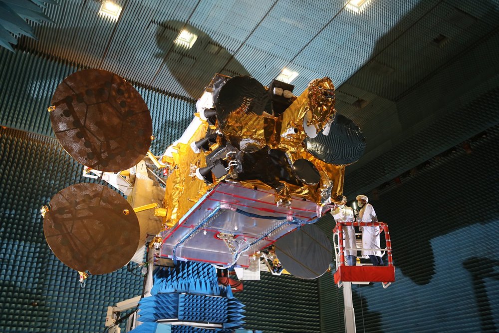 The Airbus-produced Arabsat 6B satellite is shown in an anechoic chamber for ground-based testing.