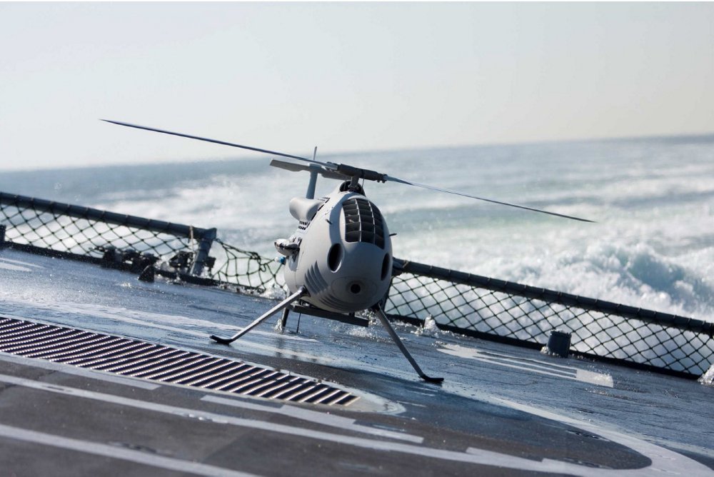 An unmanned aerial vehicle lands on a pitching and rolling ship deck equipped with the Deckfinder local positioning system. 