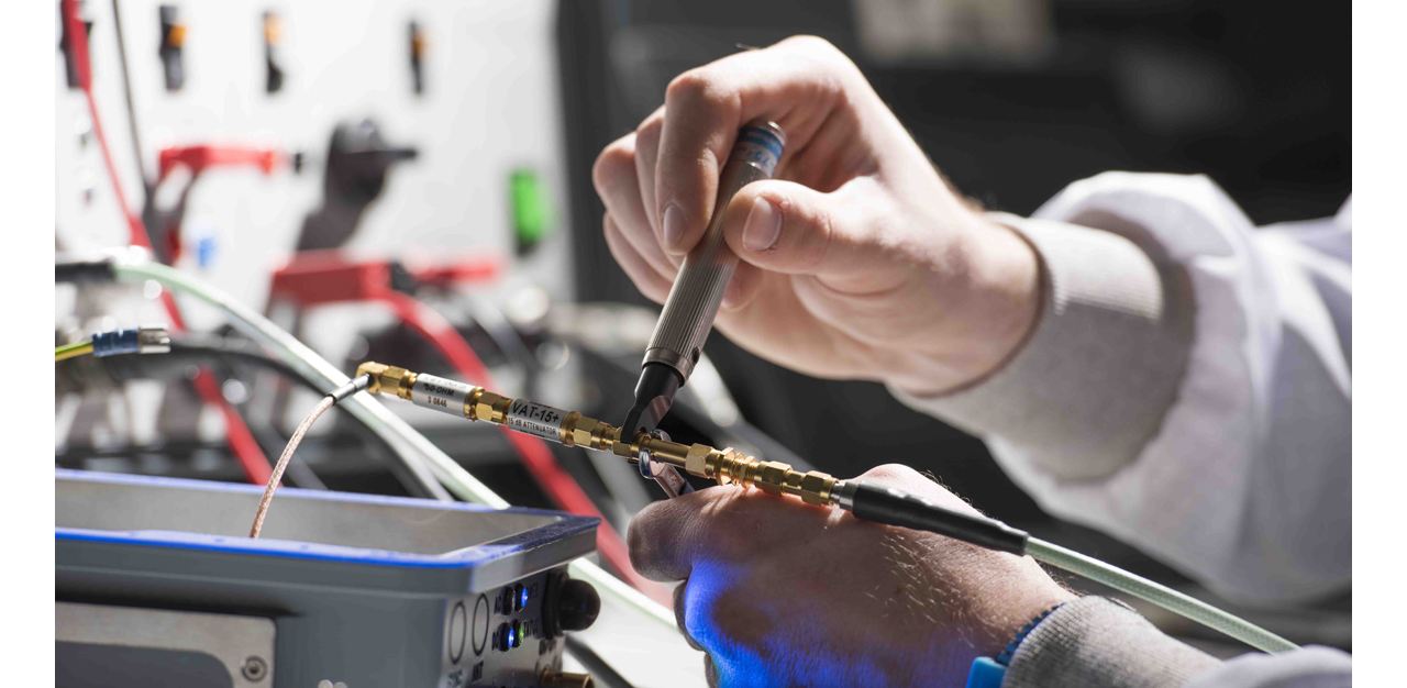 A DeckFinder component undergoes maintenance, with the focus on an engineer’s hands and tools. 